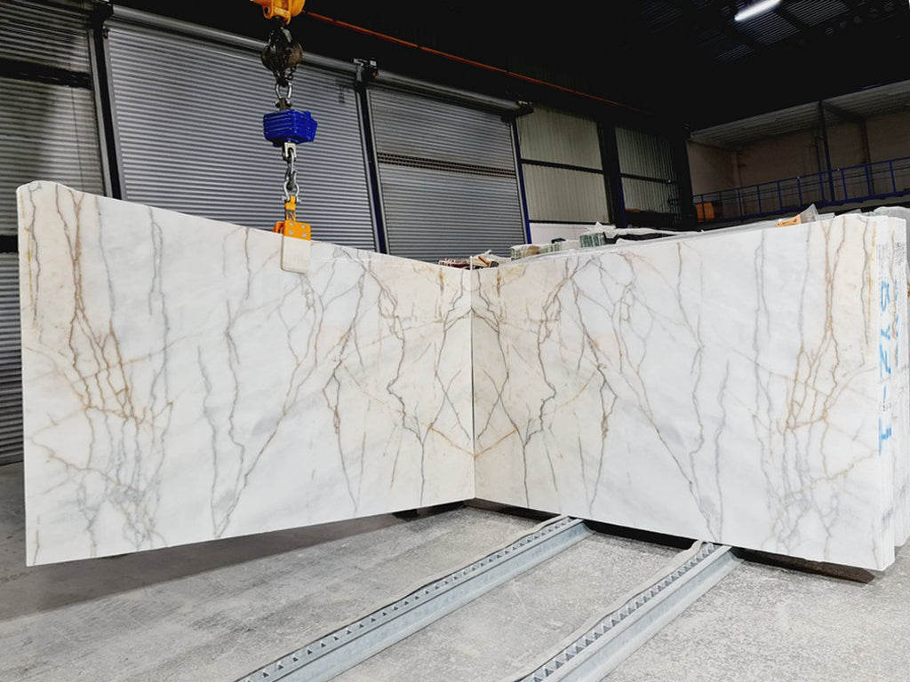 Cream & gray stone with dark veining slabs book matched