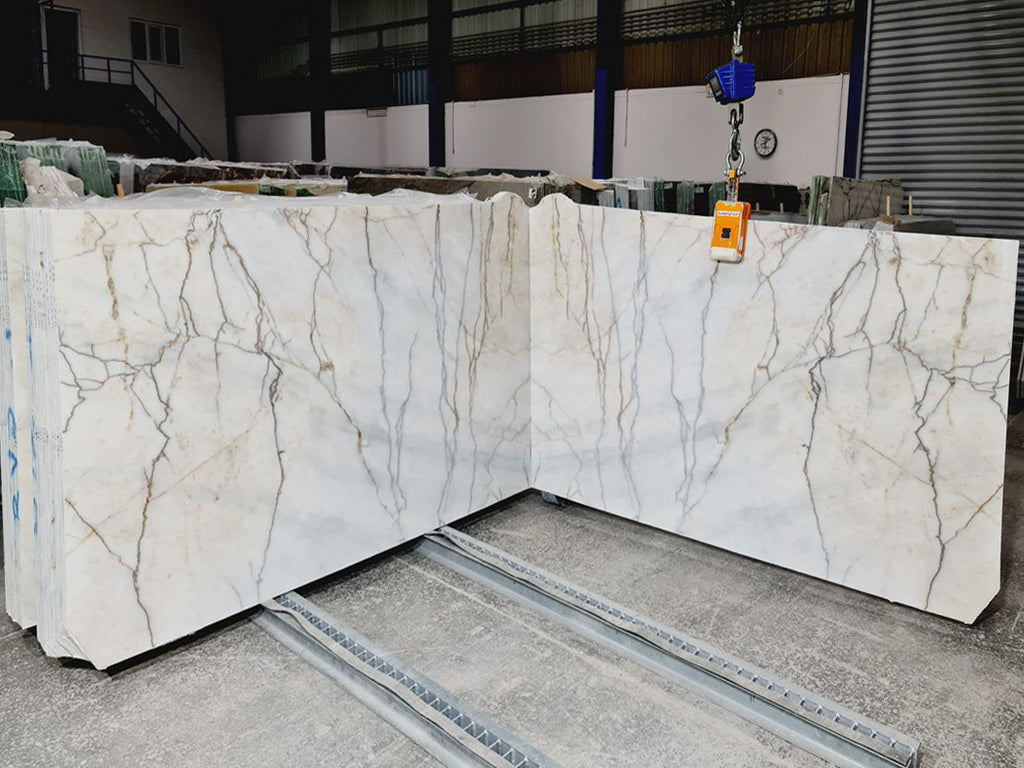 Cream & gray stone with dark veining slabs book matched