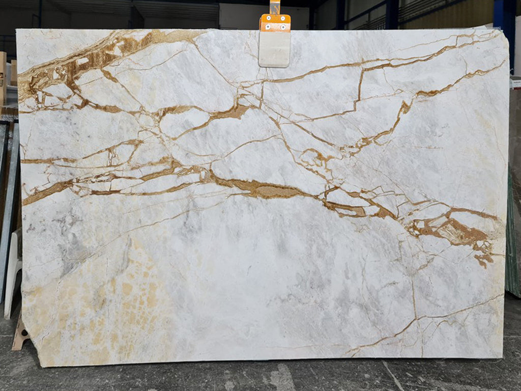 White marble with gold veining slab