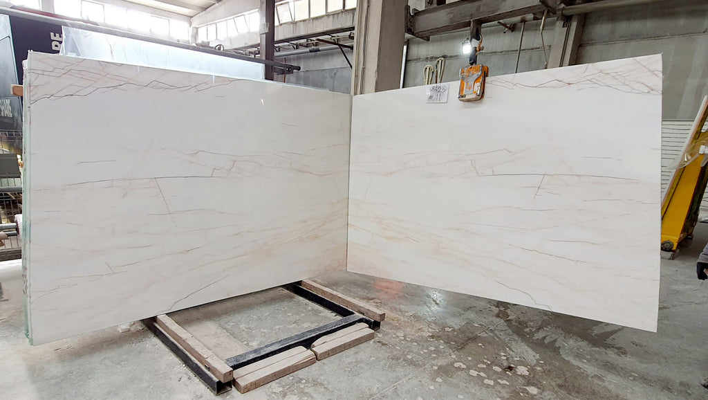 White marble with warm veining slabs book matched