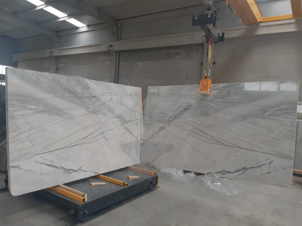 Gray marble with dark gray and black lines book matched slabs.