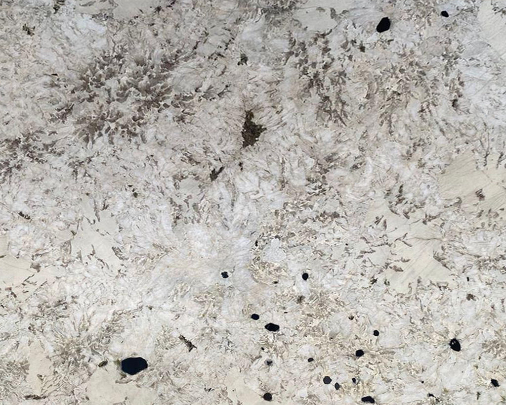 white granite with dark speckles and patterns