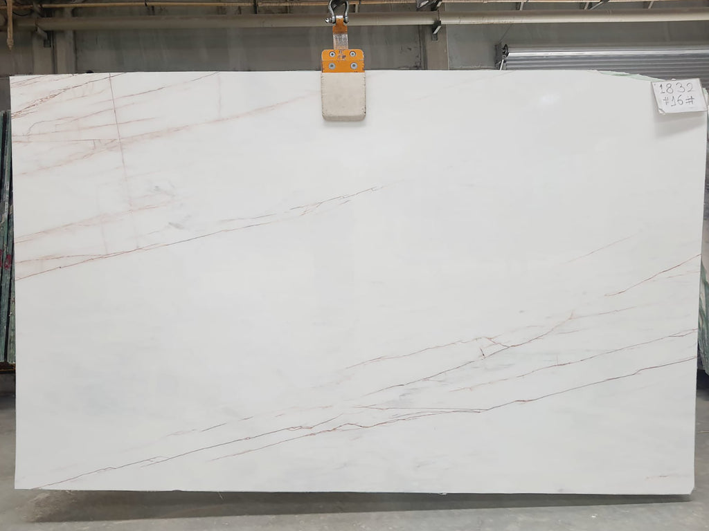 White marble with warm veining slab