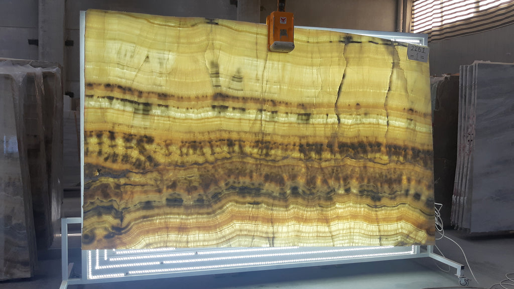 Beige Onyx with orange and blue veining slab back lit