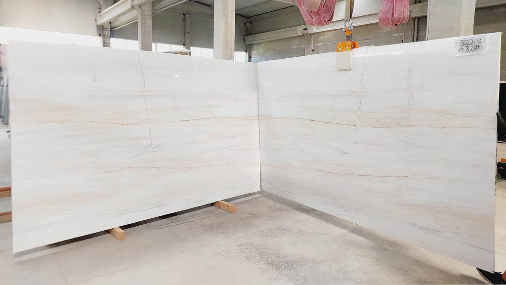 White marble with warm veining slabs book matched