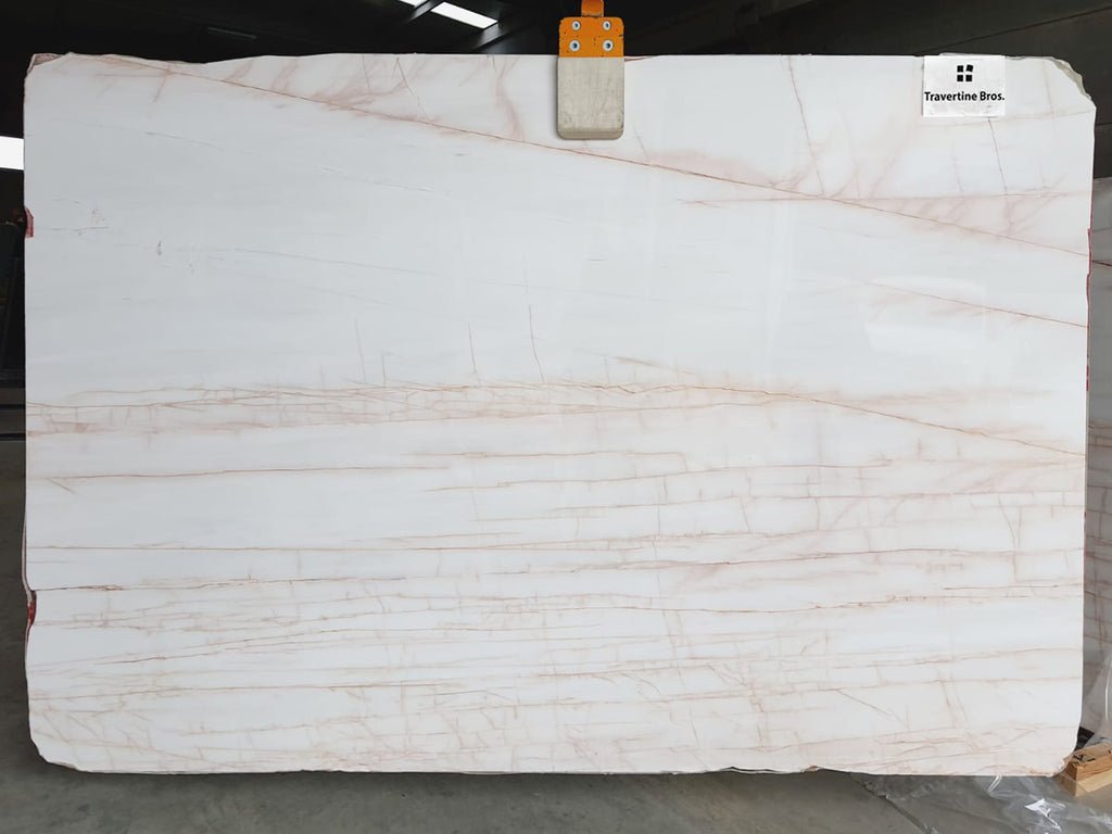 White marble with blush veining slab