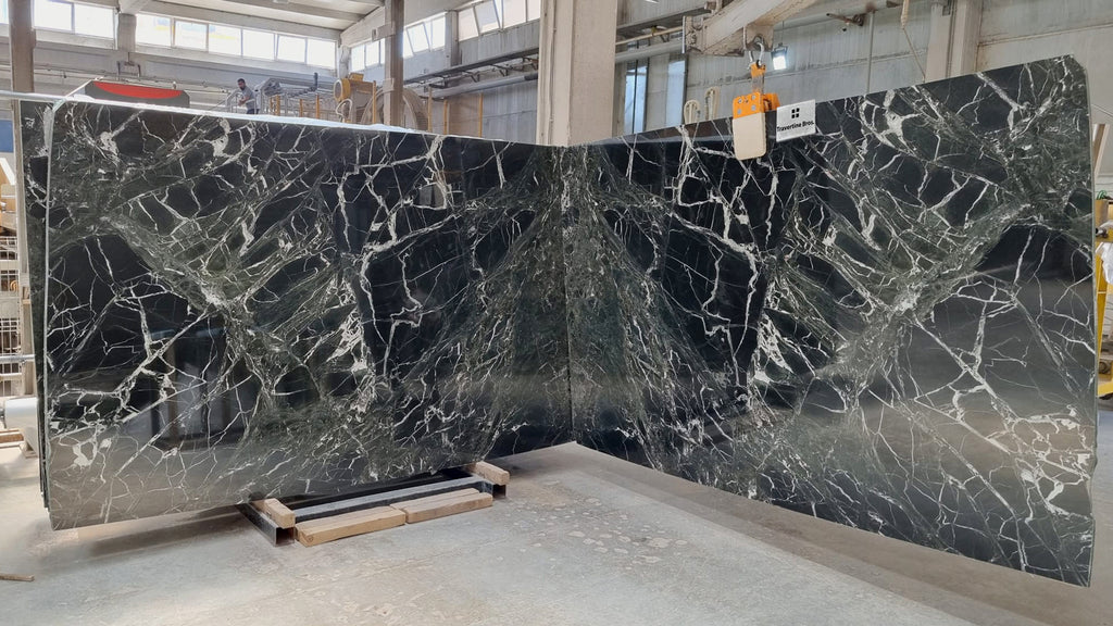 Dark green marble with white veining slabs book matched