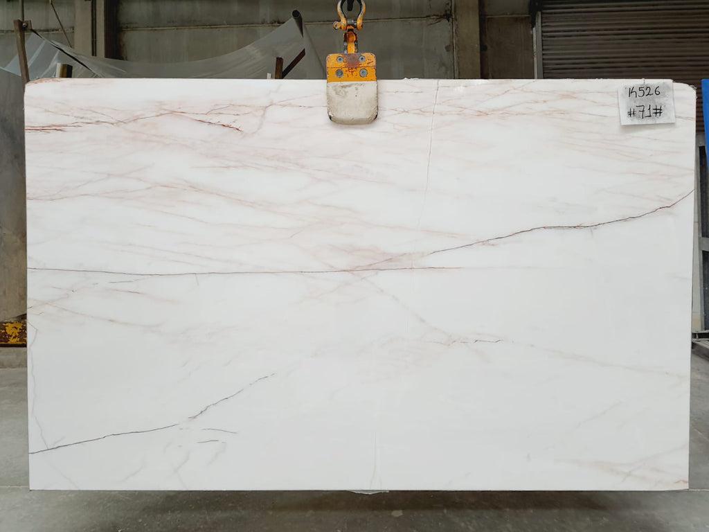 White marble with red veining slab