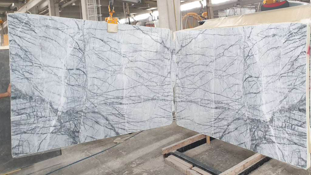 White marble with dark veining slab book matched