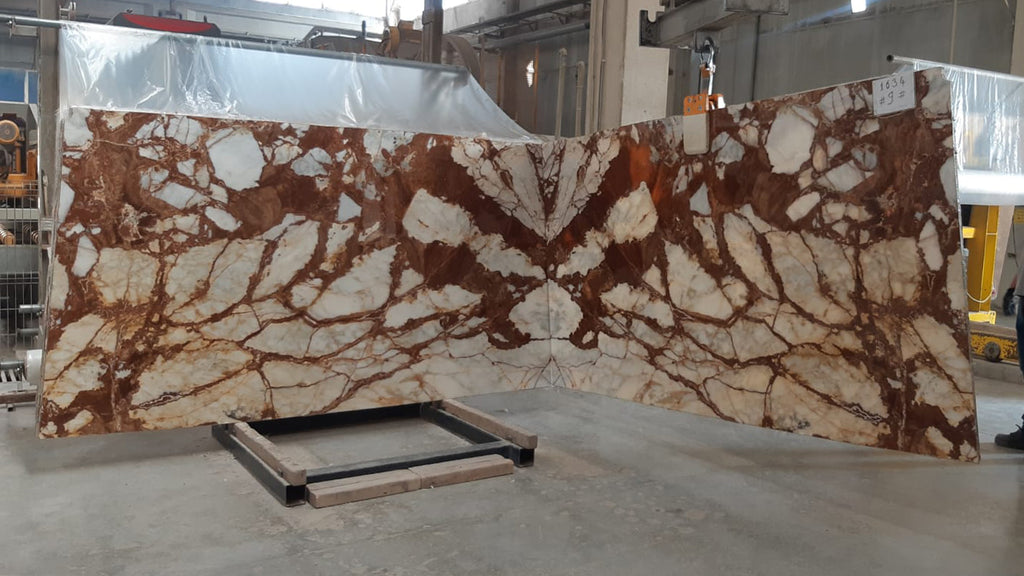 White marble with deep red veining slabs book matched