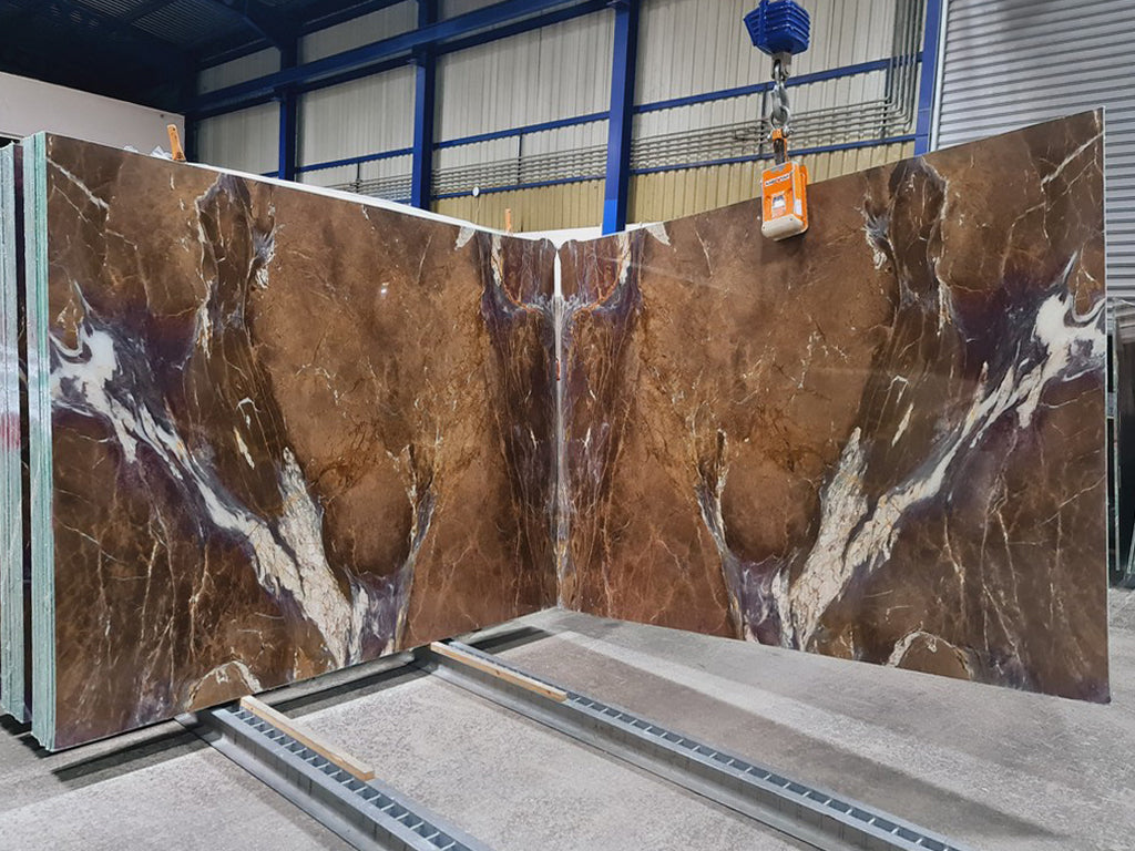 Brown marble with purple & white veining slabs book matched.