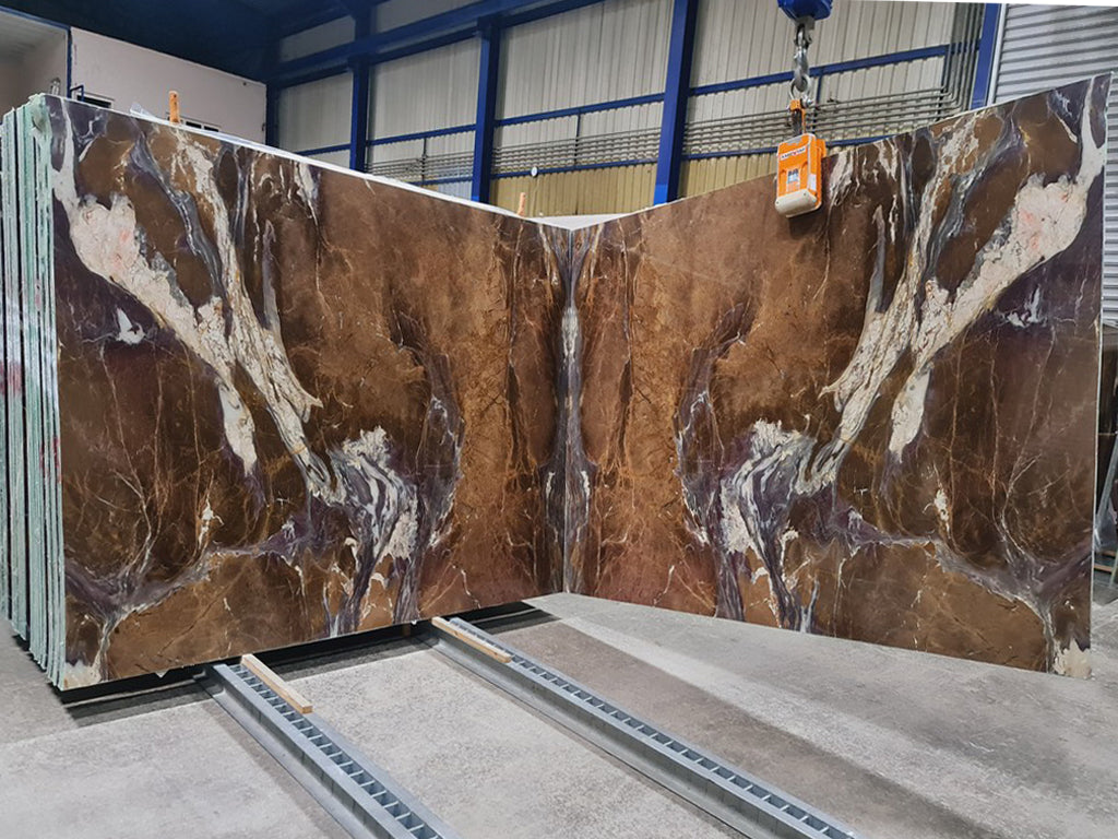 Brown marble with purple & white veining slabs book matched.