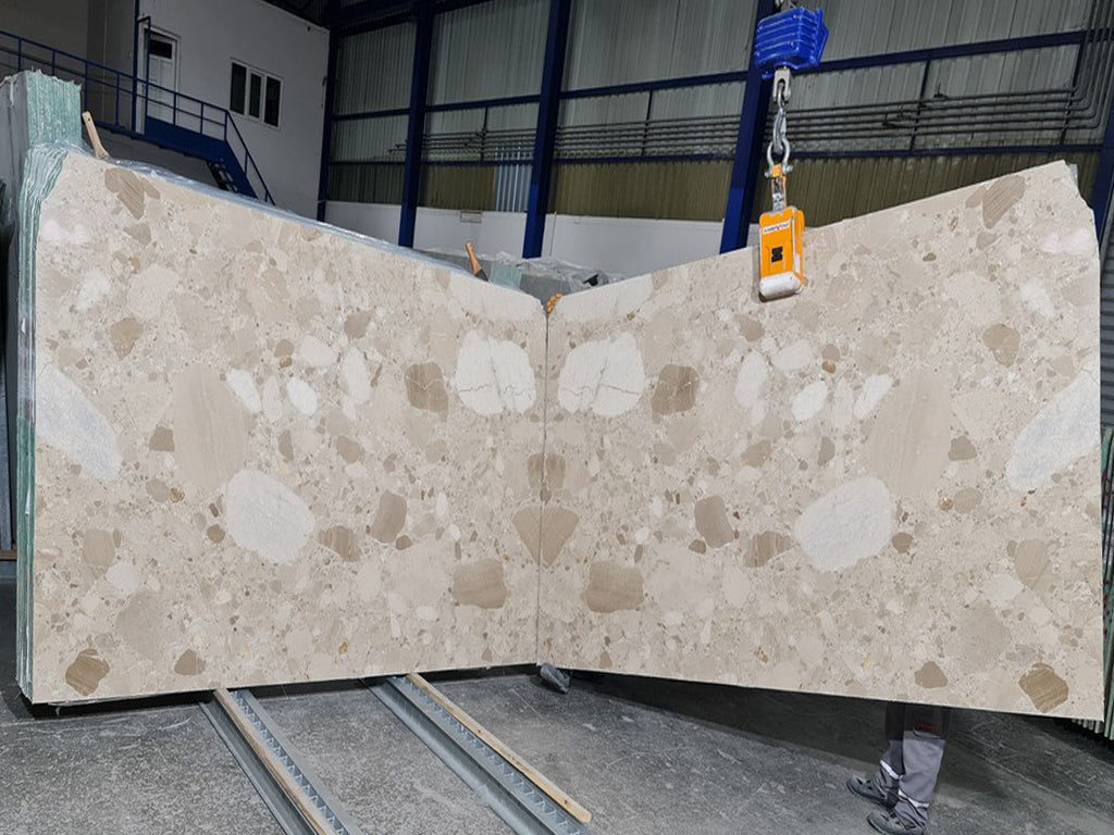 Beige marble with tonal pebble pattern slab book matched