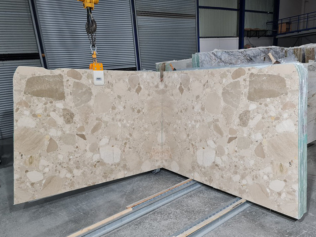 Beige marble with tonal pebble pattern slab book matched