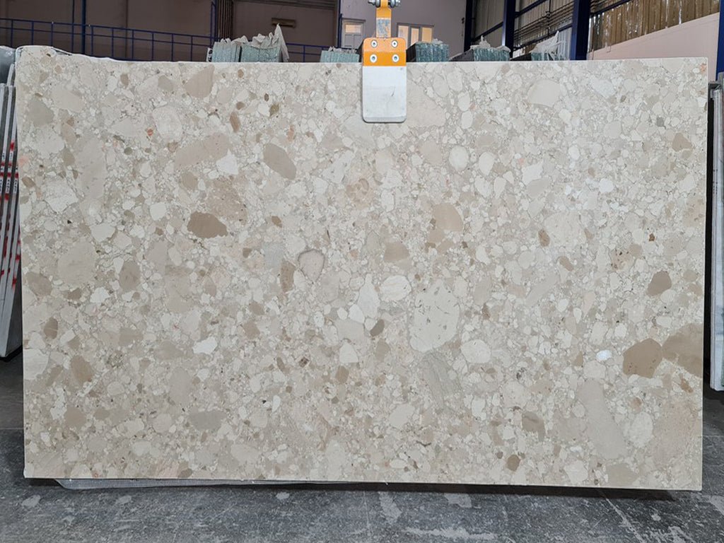 Beige marble with tonal pebble pattern slab