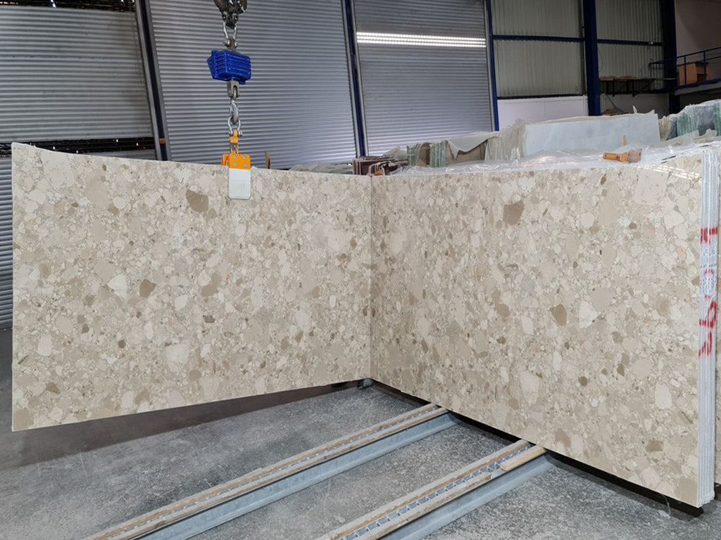 Beige marble with tonal pebble pattern slab book matched
