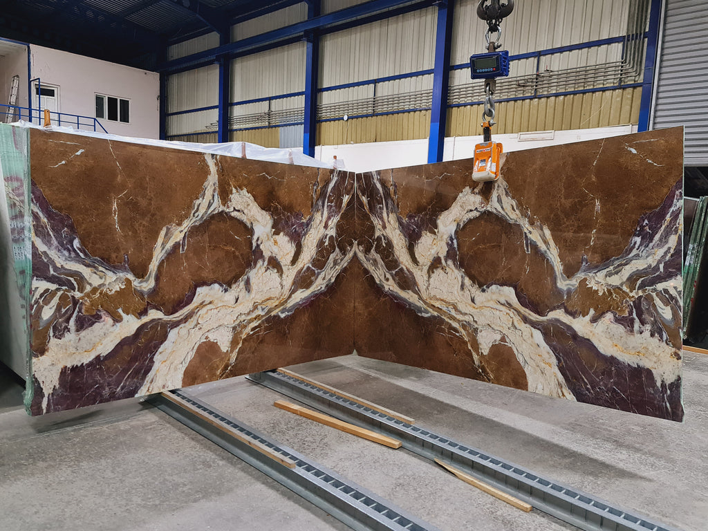 Brown and purple marble with white veining slabs book matched
