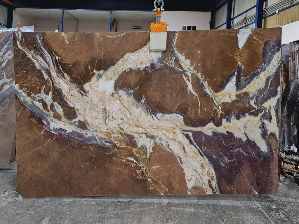 Brown and purple marble with white veining slab
