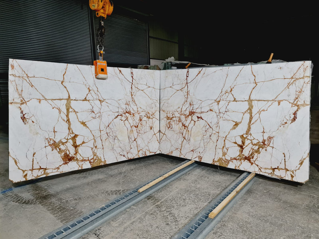 White marble with gold veining slabs book matched