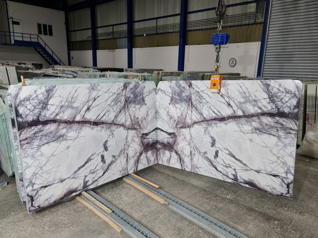 White marble with purple veining slabs book matched