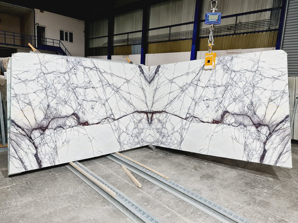 White marble with purple veining slabs book matched