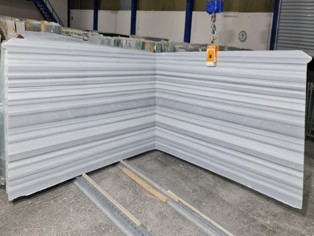 White marble with black & gray linear veining slabs book matched