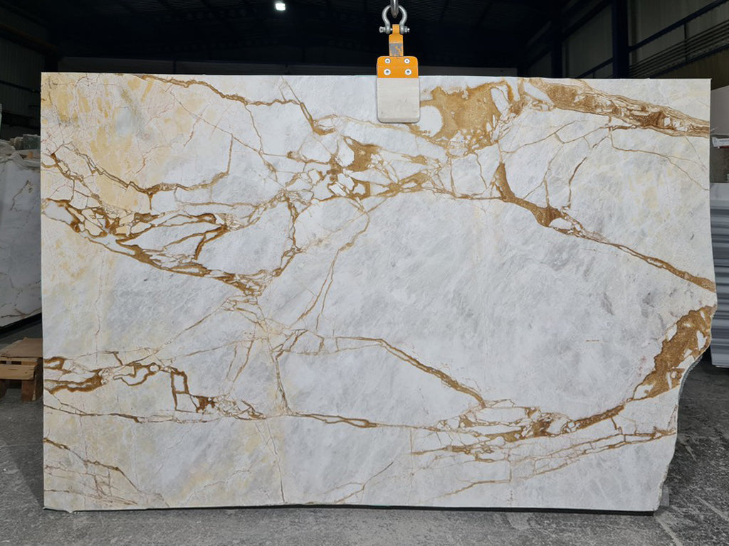 White marble with gold veining slab