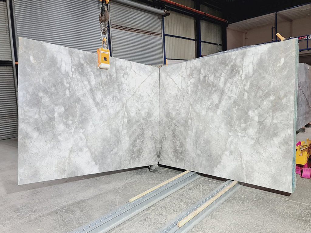 Gray stone with white veining slabs book matched