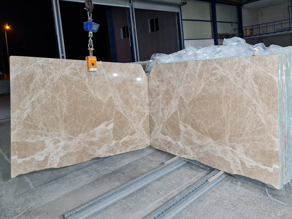 Beige marble with white veining slabs book matched