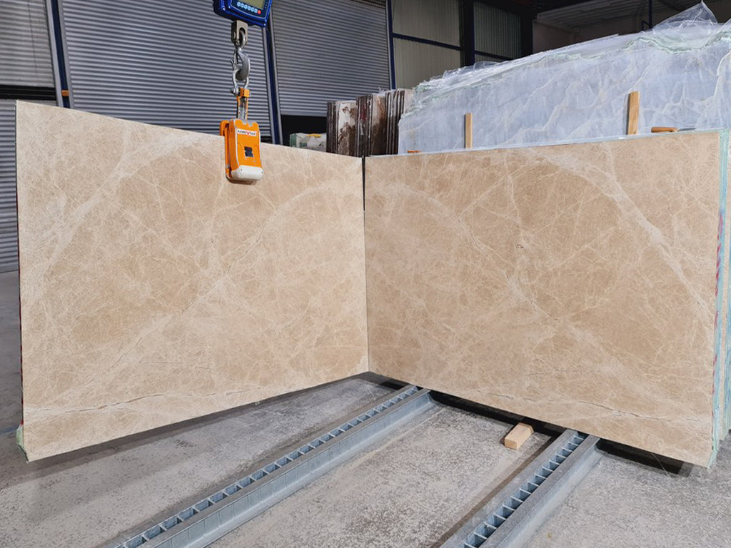 Beige marble with white veining slabs book matched