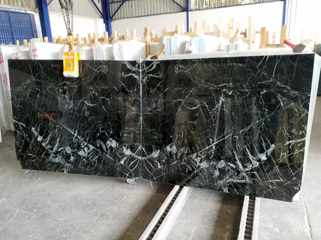 Dark green stone with white veining slabs book matched