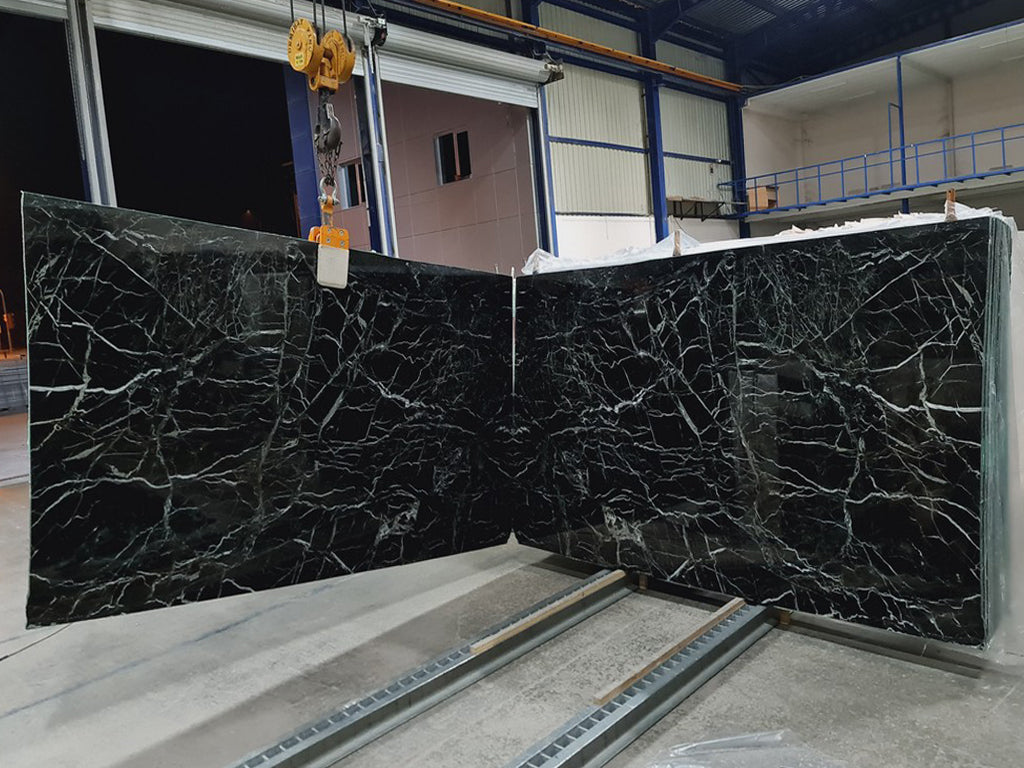 Dark green stone with white veining slabs book matched