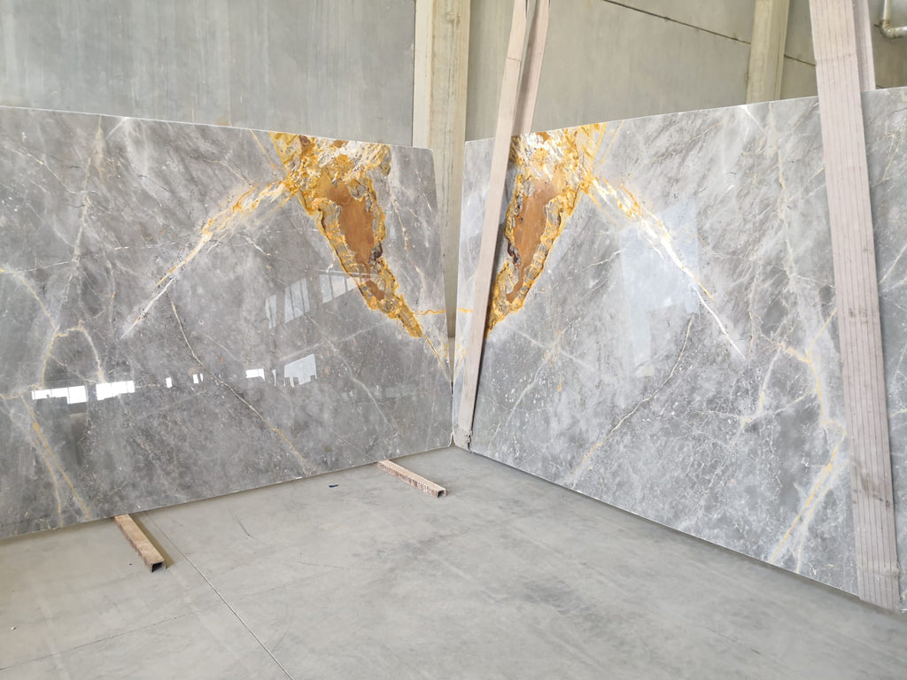 Gray marble with gold veining slabs book matched