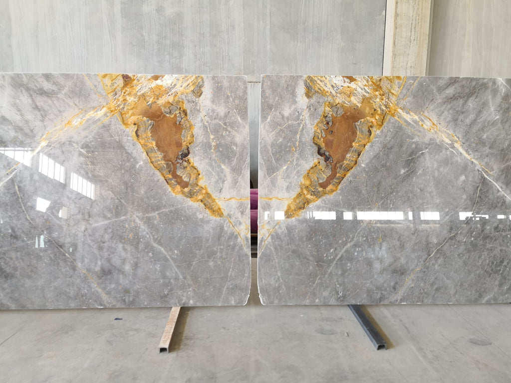 Gray marble with gold veining slabs book matched