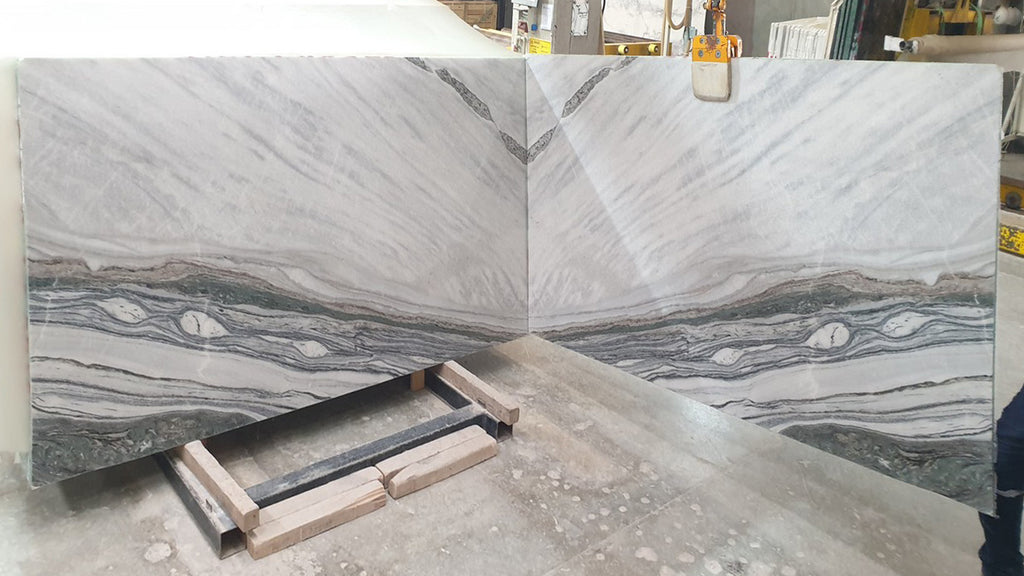 Cream stone with  gray veining slabs book matched