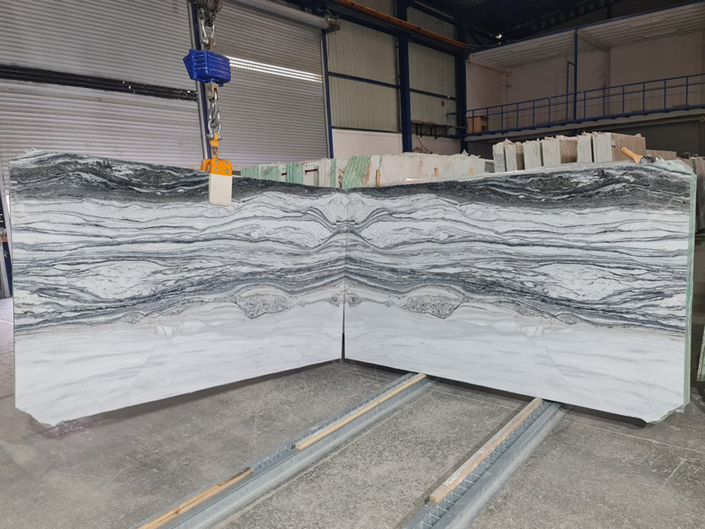 Cream stone with  gray veining slabs book matched