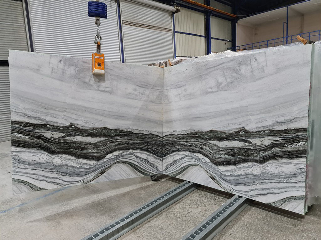 Cream stone with  gray veining slabs book matched