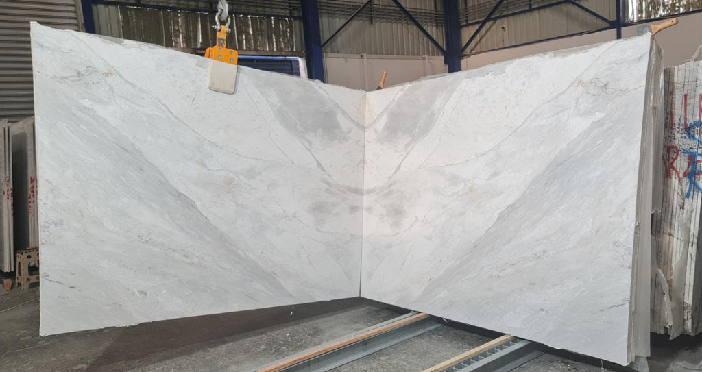 Marble with white and gray veining slabs book matched