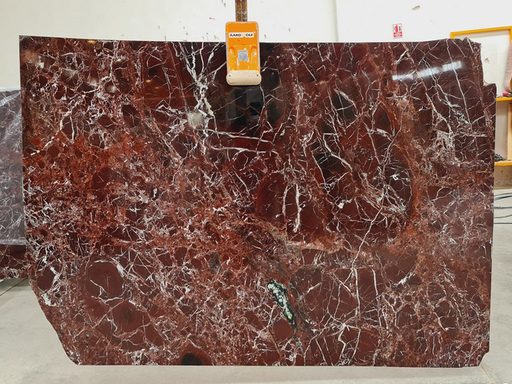 Red marble with white veining slab