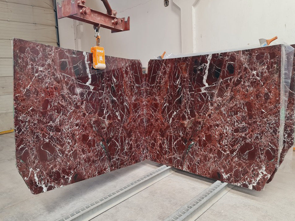 Red marble with white veining slabs book matched