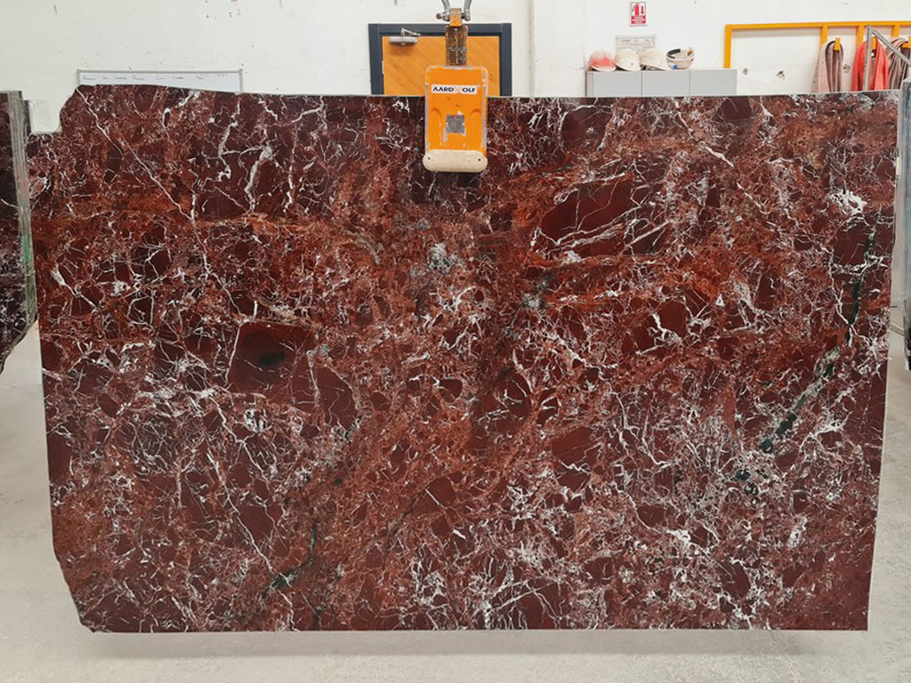 Red marble with white veining slab