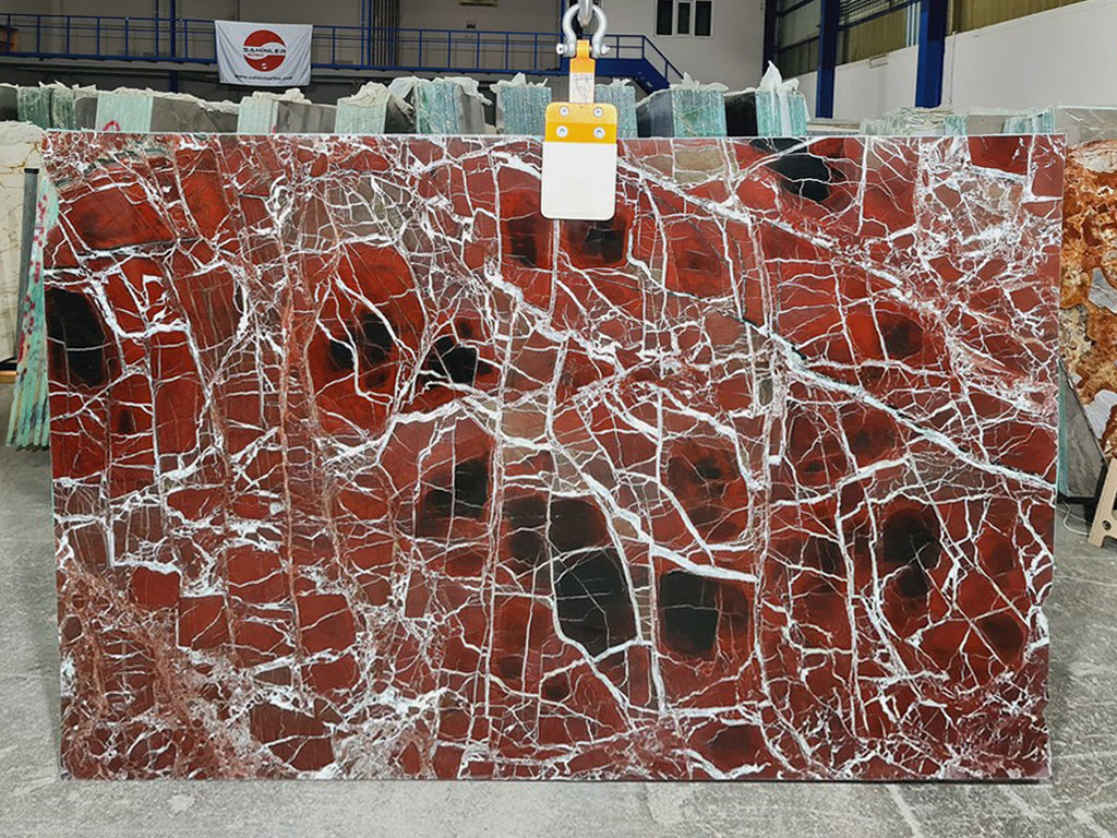 Red marble with white veining slab