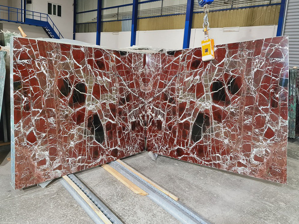 Red marble with white veining slabs book matched