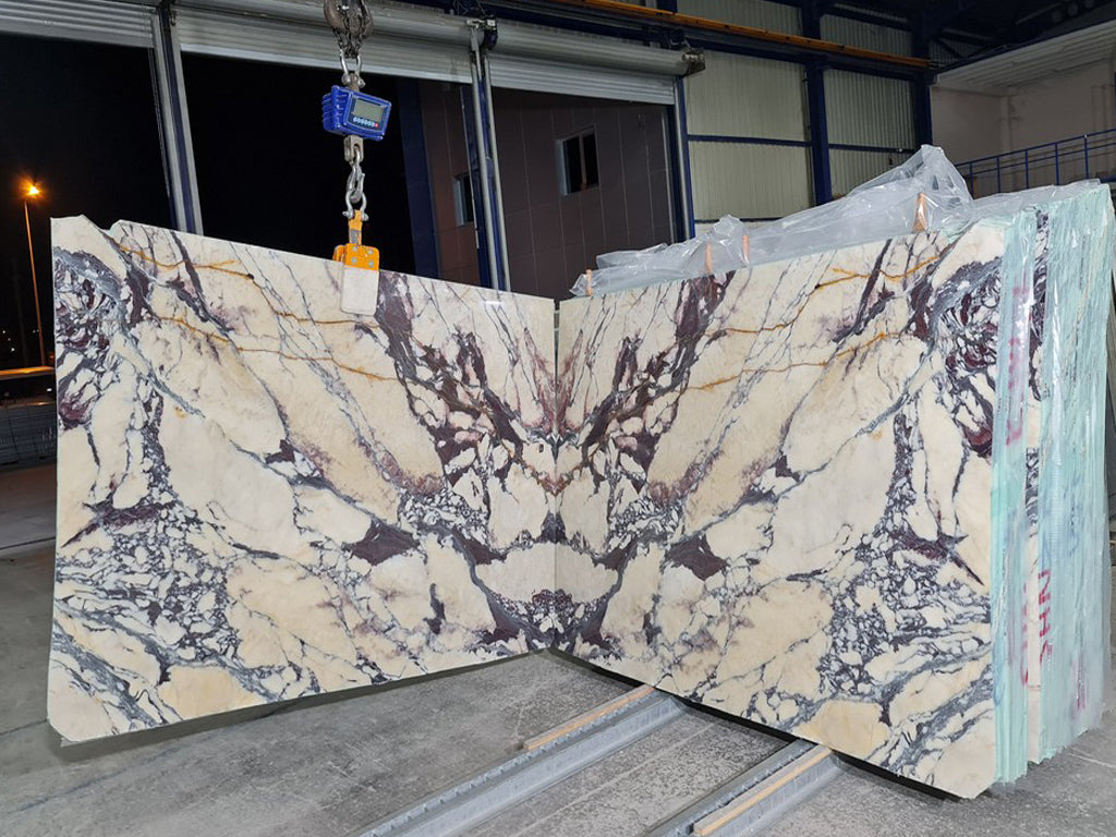 Beige marble with purple veining slabs book matched