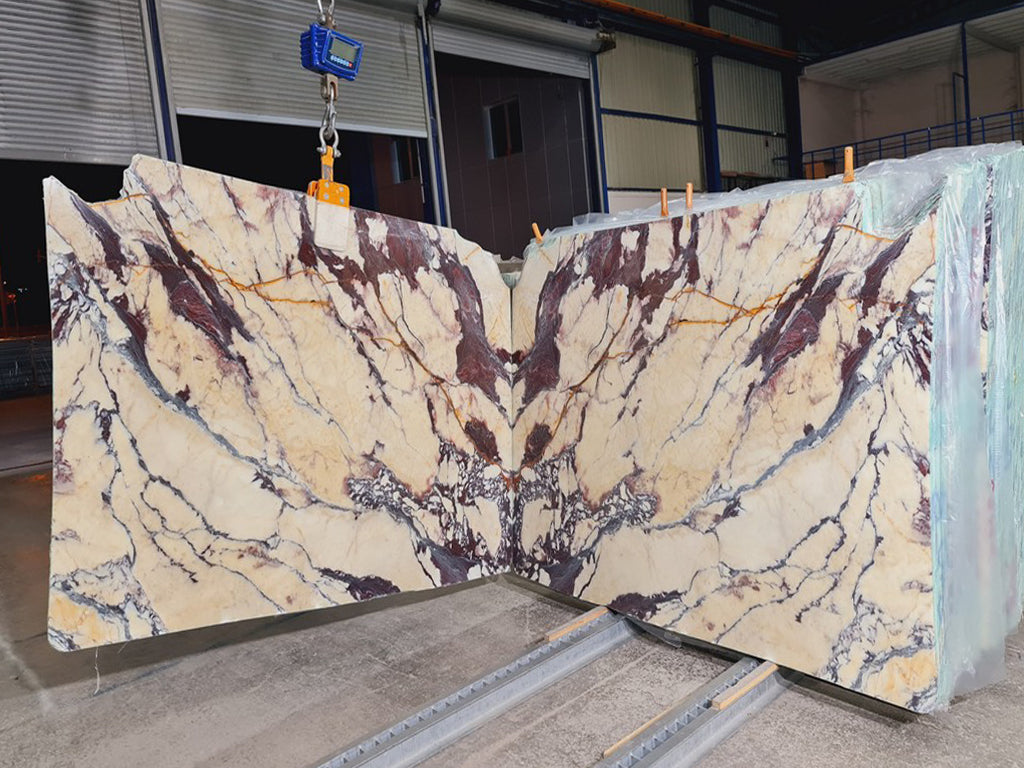 Beige marble with purple veining slabs book matched
