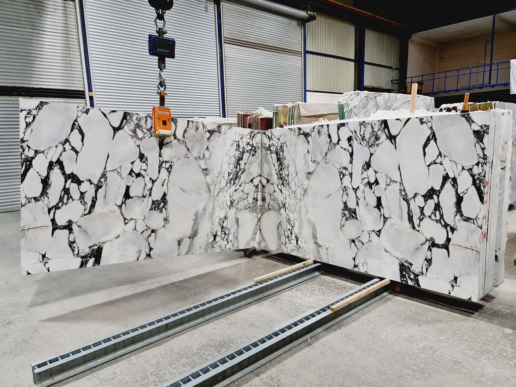 White marble with black veining slabs book matched