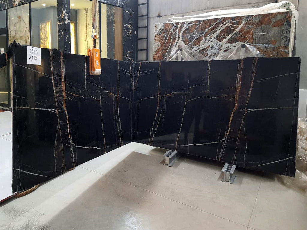 Black marble with white & gold veining slabs book matched