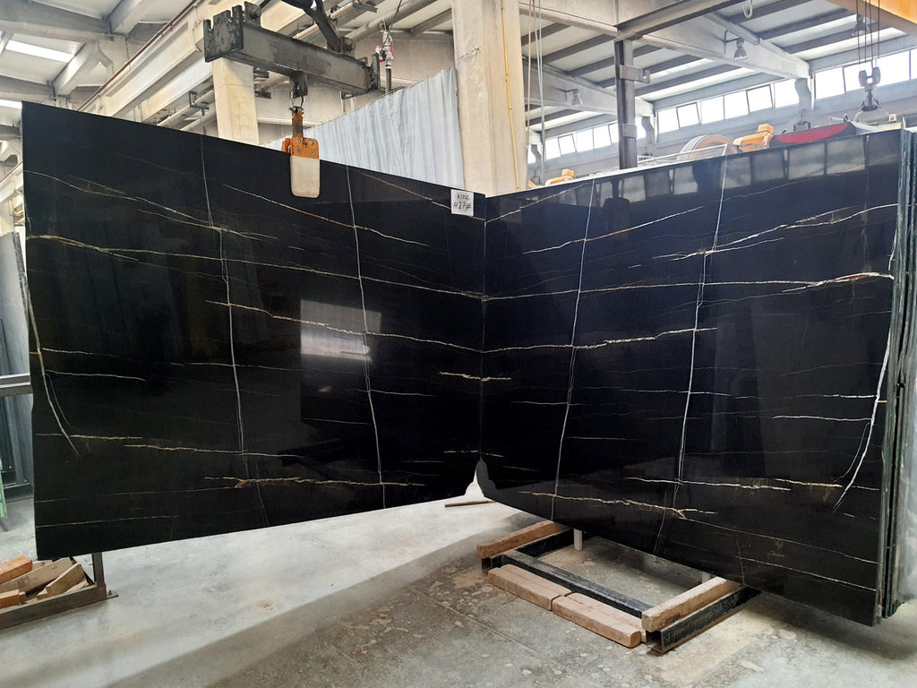 Black marble with white & gold veining slabs book matched