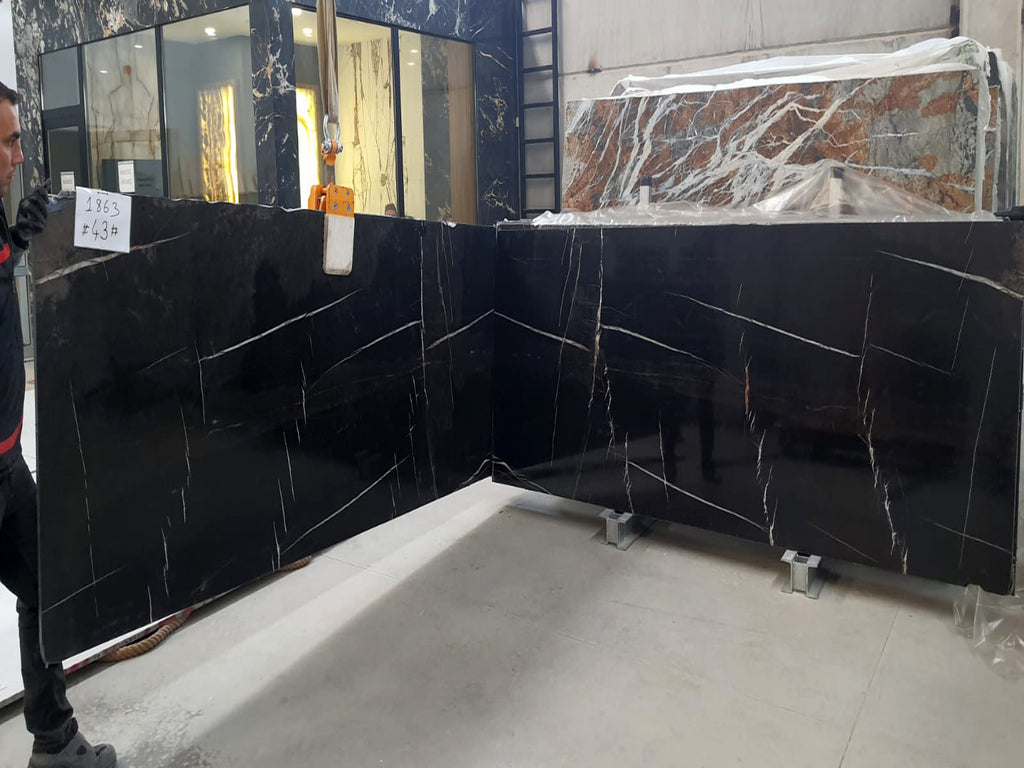 Black marble with white & gold veining slabs book matched