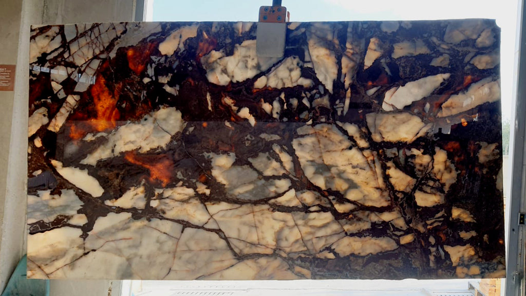 White marble with deep red veining slab back lit